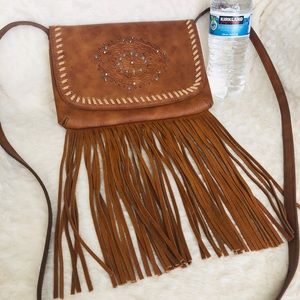 Brown, crossover, fringed western purse.